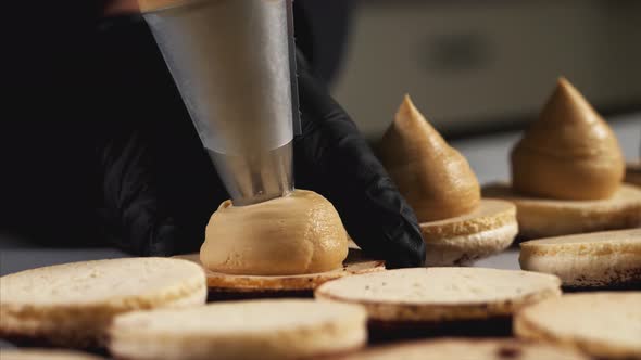 Chef Is Making Caramel Macarons Closeup