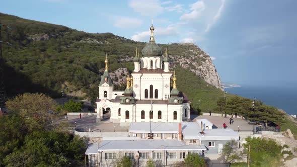 Majestic White Church High in the Mountains Shooting From a Bird'seye View