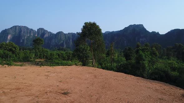 Landscape around the city of Vang Vieng in Laos seen from the sky alt