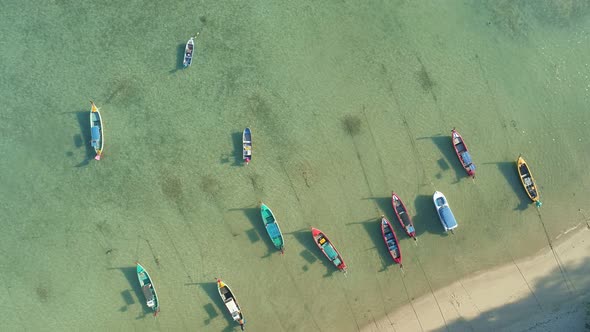 Amazing aerial Top view Longtail fishing boats in the tropical sea at Rawai beach Phuket Thailand alt