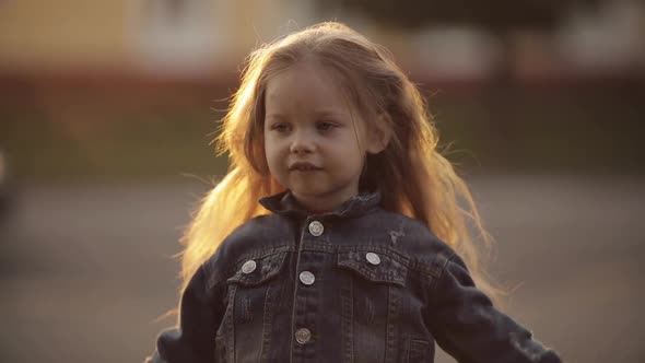 Girl Twirling and Posing with Beautiful Long Hair in Park