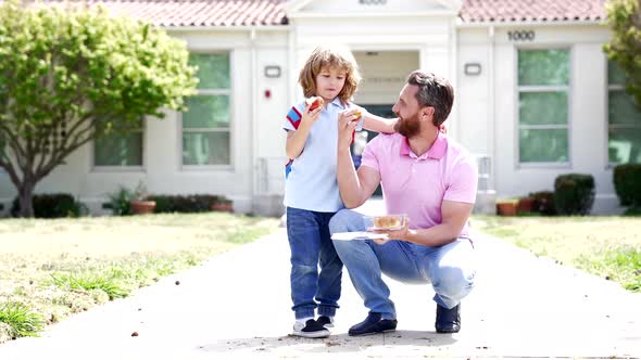 Happy Family of Child Boy and Daddy Having Lunch After School Slow Motion Childhood