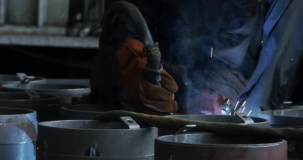 A Professional Welder Makes Steel Structures at the Factory alt