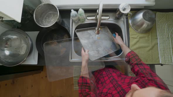 Rapid Time Lapse of a Man Washing Dishes
