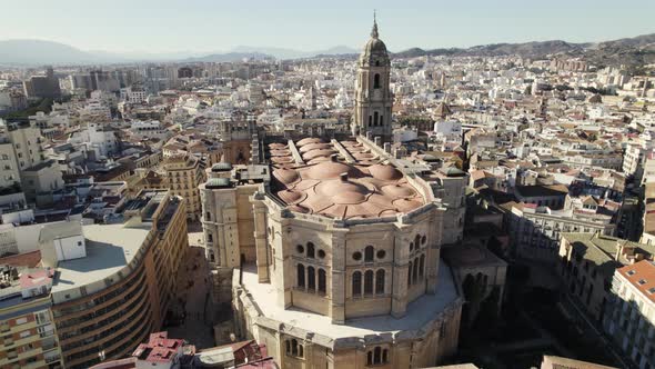 Cathedral of Incarnation in Malaga historic center with cityscape, Spain. Aerial circling