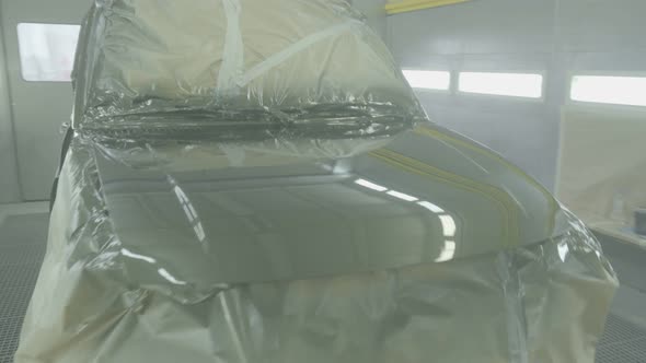 Painting an SUV Car in a Modern Spray Booth. Professional Car Painting. Corrosion Protection alt