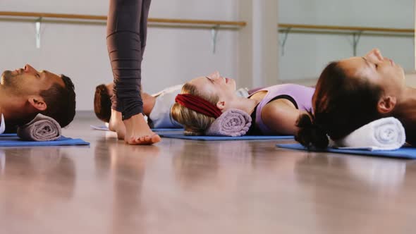 Group of people performing yoga alt