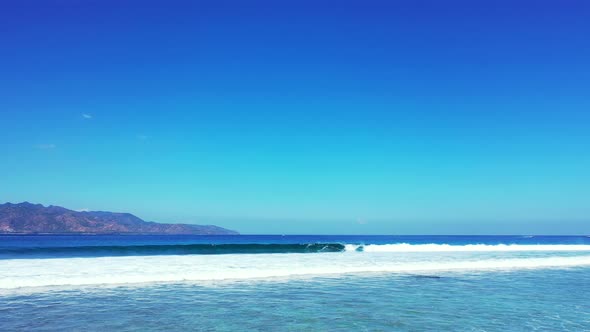 Wonderful Scenery Of Blue Calm Sea With Clear Blue Sky Above, Bali Island, Indonesia - Aerial Shot alt