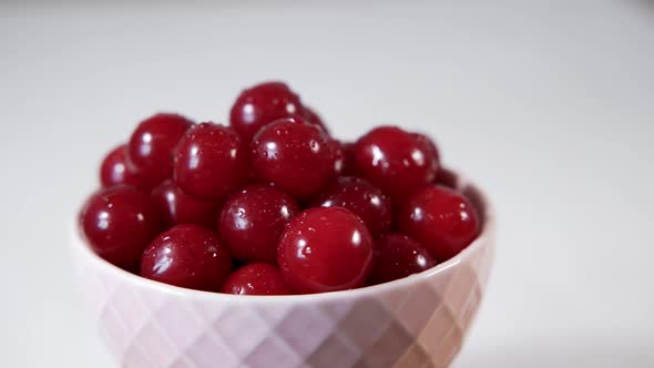 White Cup with Ripe Fresh Cherries