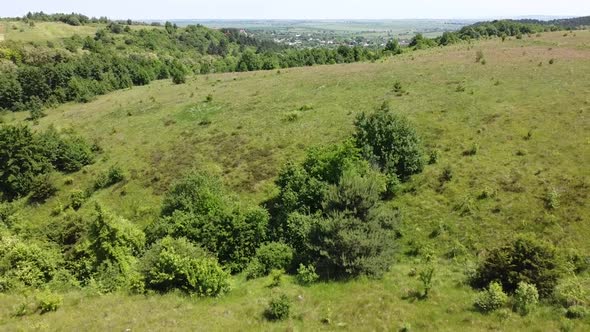 Aerial drone view of a flying over the rural agricultural landscape. alt