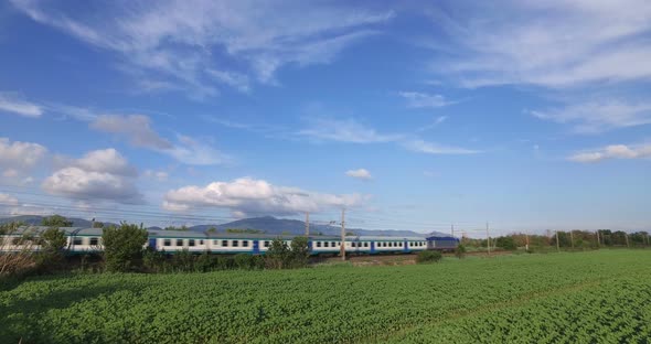 Transit Train Over Green Field alt