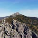 Aerial view of the mountains with rocks and beautiful autumn woods on the slopes - VideoHive Item for Sale