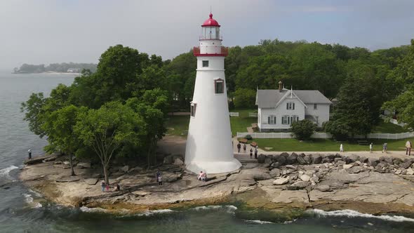 Marblehead Lighthouse along Lake Erie in Ohio drone time lapse video. alt