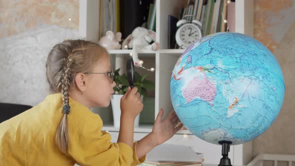 Caucasian Blond Girl with Globe