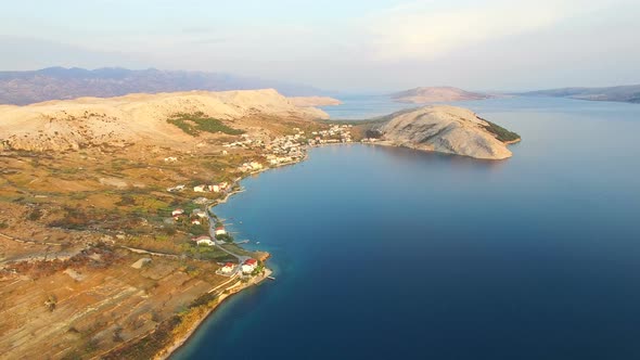 Flying above apartments for tourists on the island of Pag on Dalmatian coast alt