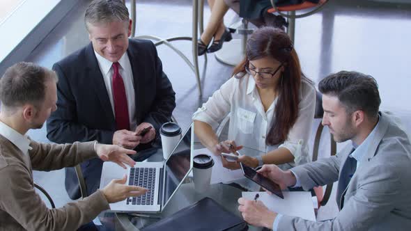 Group of business people meeting and having coffee