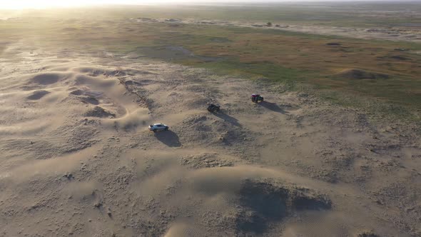 Desert Safari Offroading Group of Car 4X4 Vehicle Rides on Desert Dune Barkhan alt