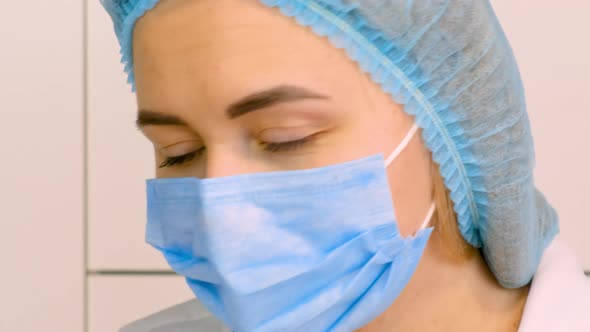 Doctor Looks with Tired Eyes alt