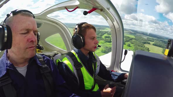 Novice Pilot Aviating Plane with Flight Instructor, Stock Footage ...