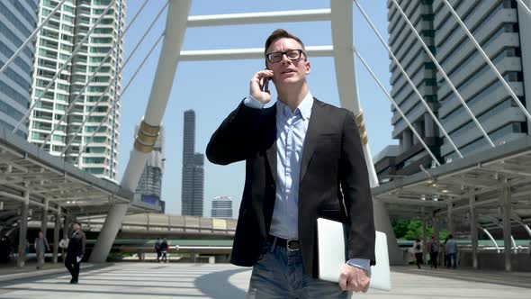 Entrepreneur Talking On Phone At Modern City