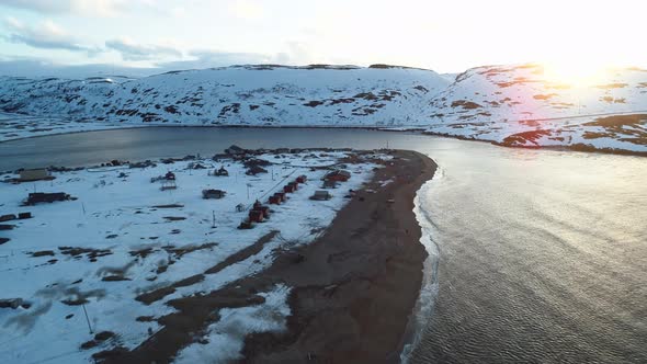 The Drone Flies Low Over a Fishing Village in the Bay of the North Sea alt