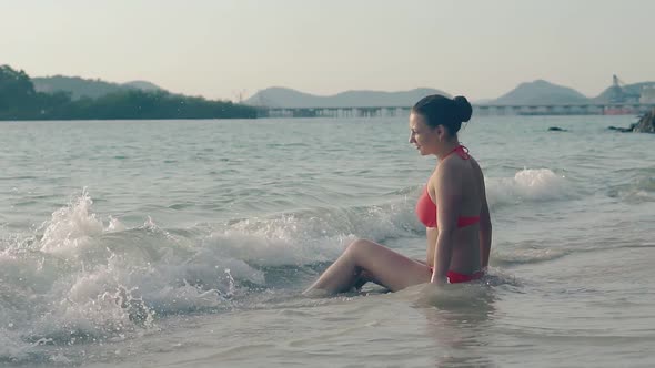Young Woman Enjoys Rolling Waves on Sea Coast Slow Motion alt