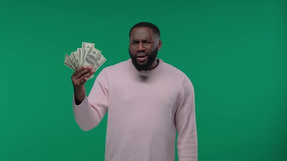 Black Man Shows Cash or Credit Card. Money Banknotes and Card, African American Man Guy in Casual alt