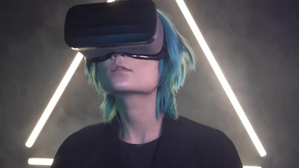 Young Man with Colored Hair Wearing Virtual Reality Glasses alt