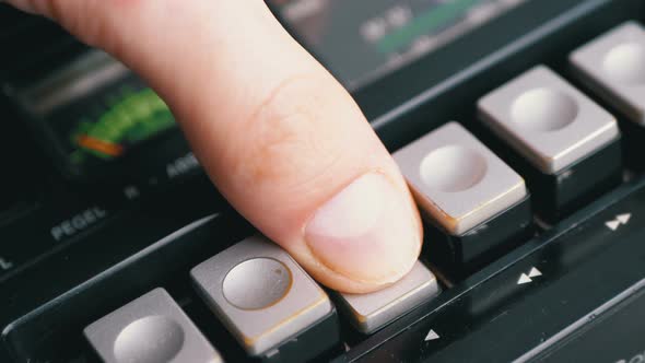Pushing Play Button on a Vintage Tape Recorder. Transistor Retro Radio alt