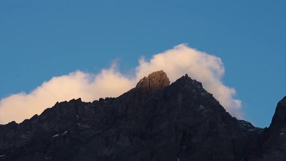 Timelapse of clouds passing over Piltriquitron Hill summit at sunset, El Bolsón, Patagoia Argentina. alt