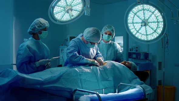 A Lower Shot of a Surgeon Giving an Operation to