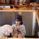 Woman Sitting Together with Her Huge Adorable Dog While Cooking at Home - VideoHive Item for Sale