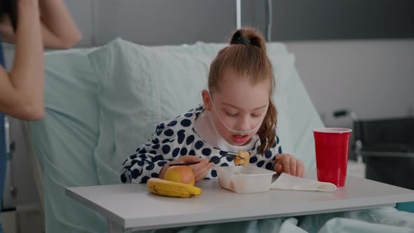 Portrait of Hospitalized Little Chid Lying in Bed in Recovery Examination Room alt