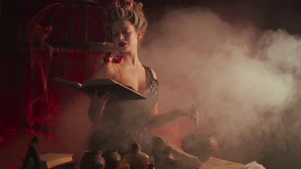 Halloween Witch with Cauldron and Magic Book alt