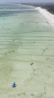 Tanzania  Vertical Video Kitesurfing Near the Shore of Zanzibar Slow Motion alt
