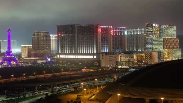 MACAU/CHINA - JULY 03 2019: Macau Cotai Aerial Cityscape Night Timelapse Pan Up alt