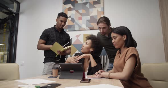 Diverse Colleagues Working on Project Together alt