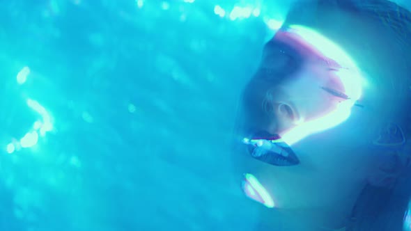 Amazed Alien Woman in Neon Light and Laser Beams alt