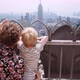Mother And Boy Looking Over Railings On Rooftop To New York City - VideoHive Item for Sale