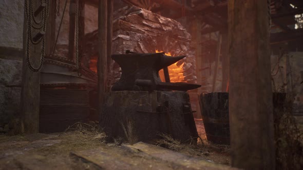 Blacksmiths Tools Hammer and Anvil in Old Blacksmiths Workshop alt