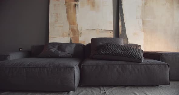 The Modern Minimalist Living Room with Black and Gray Tone Large Paintings alt