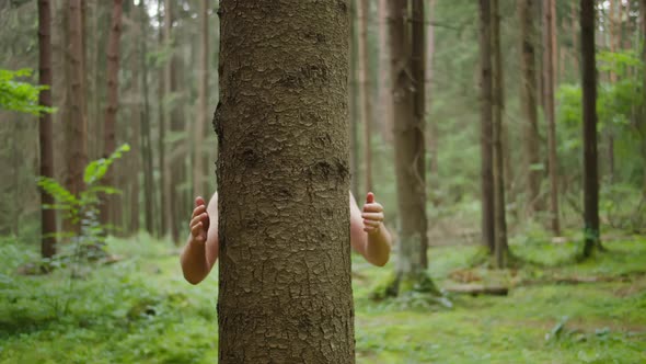 Man with His Hands Hugs a Tree Trunk, Unity with Nature, Environmental Protection alt