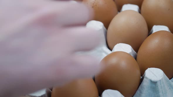 Hand Changes the Broken Egg to the Whole Golden Egg on Platform  Close Up alt