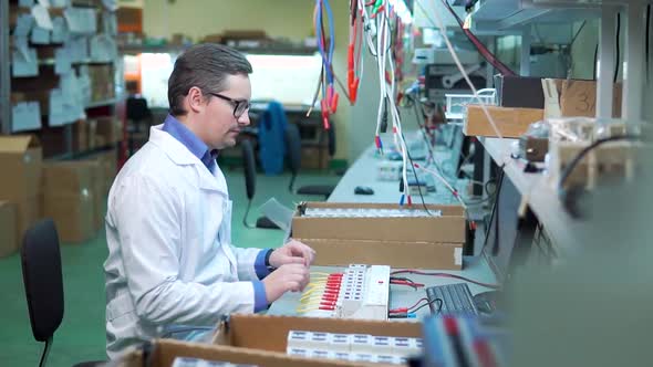 The Energetic Young Man Is a Technician or Engineer Checks or Repairs the Electronic Equipment in alt