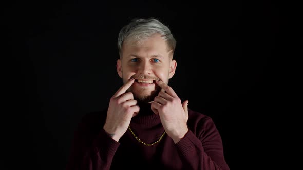 Stylish Young Man Looking at Camera Feeling Happiness Fun and Enjoyment Showing Smile Gesture alt