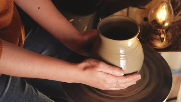 Woman Makes Jug of Clay in Pottery Workshop Smiles Happy Beautiful Footage Background Authentic