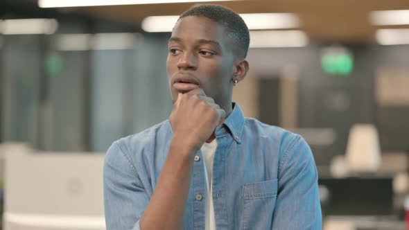 Pensive Young African American Man Thinking alt
