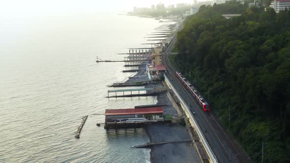 A Train Is Going Along the Sea alt