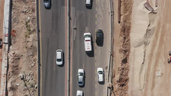 Ambulance making his way and arriving to a Car crash scene on a highway, Aerial follow footage.