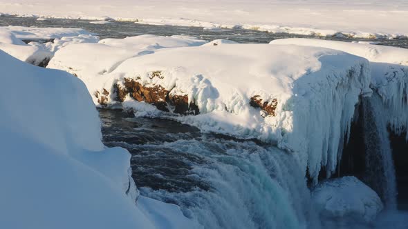 Sunlit Godafoss Waterfall and Skjalfandafljot River with Snow alt
